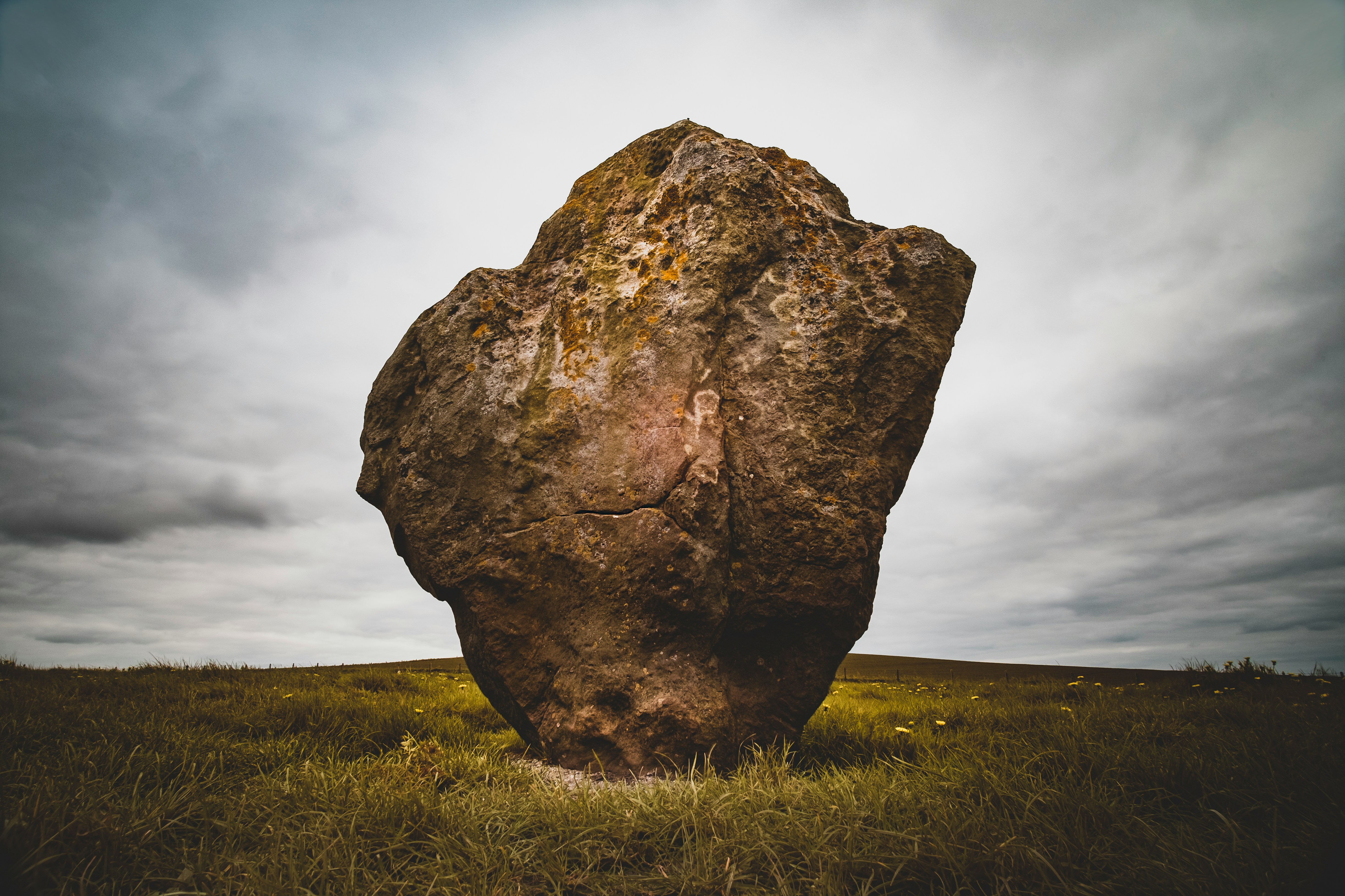 A large rock shown against the sky